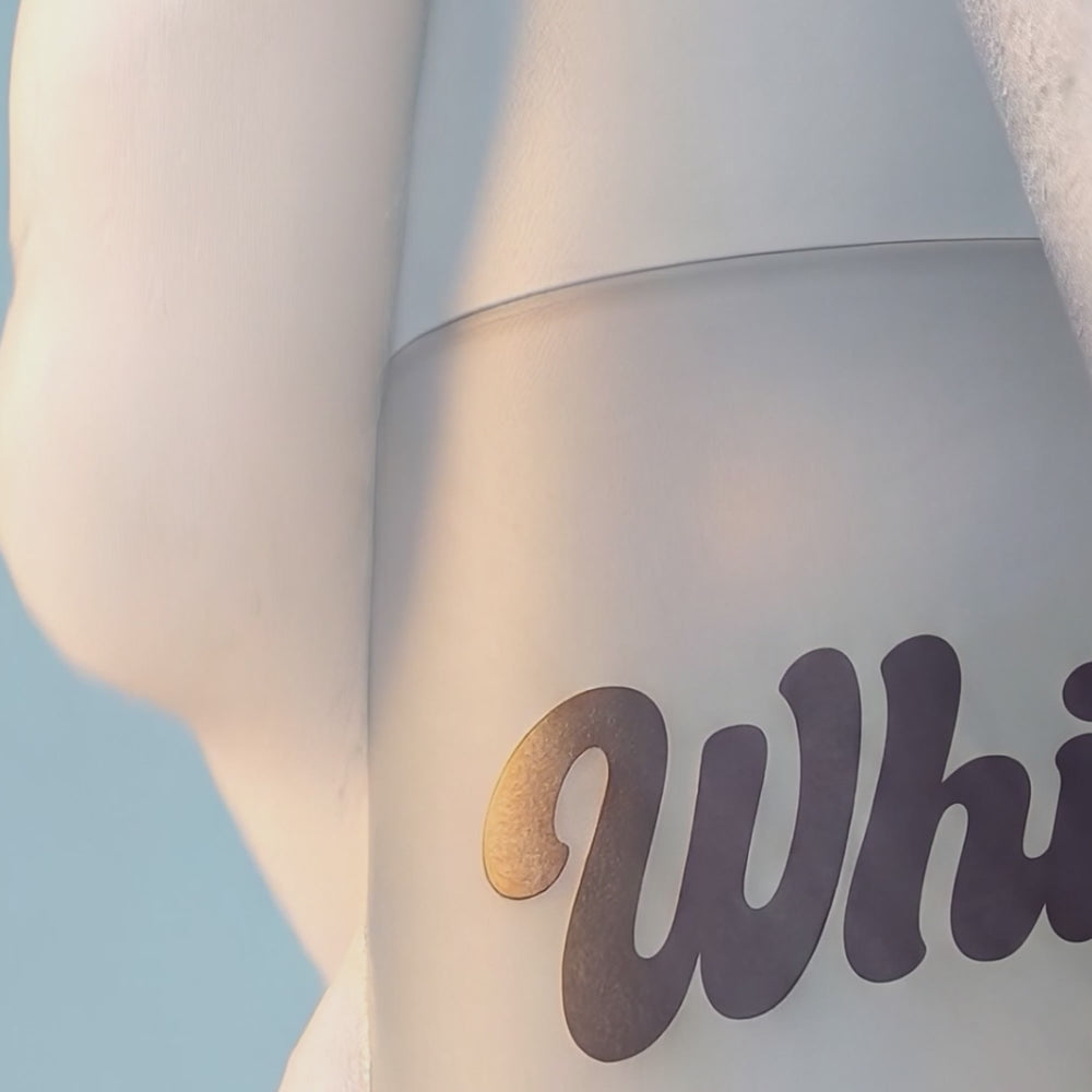 Close-up of Whippy Sea Salt and Cashmere Whipped Body Wash bottle with foam lather